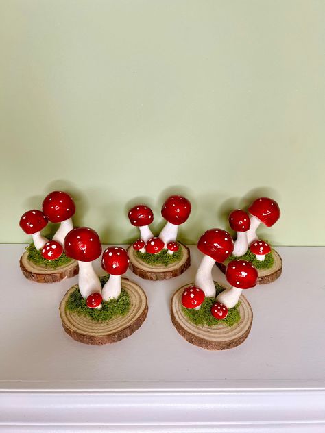 This lovely and cheerful set of  5 red lucky mushrooms will add joy, color and charm to your home. Perfect for your holiday table. Measurements:  Wooden stand: in diameter approx. 3 1/2 inches Mushrooms (the tallest): 3 1/2 inches Materials: painted foam mushrooms, real moss and wood They will definitely make home merry! (-: Mushroom Table Diy, Mushroom Table Setting, Mushroom Centerpiece, Mushrooms Real, Mushrooms Decor, Table Measurements, Halloween Village, Mushroom Decor, Wood Rounds