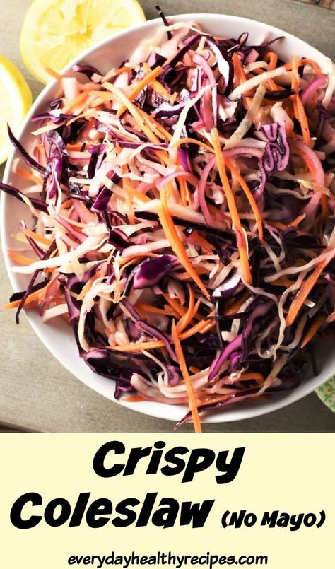 Top down view of coleslaw in white bowl with lemon wedges in background. Crispy Coleslaw Recipe, Recipe Coleslaw, No Mayo Coleslaw, Zesty Salad, Vegan Coleslaw, Classic Salad, Dairy Free Breakfasts, Coleslaw Recipe, Easy Delicious Recipes