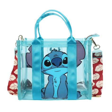 Unleash the magic of Ohana with this enchanting Lilo & Stitch glitter print tote bag. The clear blue bag features a delightful image of Stitch on the front, capturing the heartwarming spirit of the beloved characters. Measuring 8.5” W x 10.5” H x 11” D, this synthetic leather bag comes with a detachable strap, mirroring Lilo’s iconic dress pattern. Wipe the bag clean for effortless care. Lilo And Stitch Merchandise, Lilo And Stitch Quotes, Stitch Backpack, Stitch Toy, Lilo And Stitch Drawings, Whatsapp Wallpaper Cute, Stitch Quote, Lilo Y Stitch, Stitch Drawing