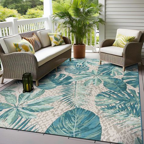 PRICES MAY VARY. Durable Material: Crafted from 100% Polyester pile for long-lasting quality that stands up to everyday use. Budget-Friendly Transformation: Elevate your decor affordably with this versatile indoor/outdoor rug that enhances both your indoor and outdoor spaces. Kid and Pet-Friendly: This non-shedding rug with a sleek pile height is perfect for homes with children and pets, ensuring a comfortable and clean environment. Weather-Resistant Durability: Designed with flatweave weather-r Hawaiian Home Decor, Indoor Pool Design, Hawaiian Homes, Rug Gallery, Outdoor Area Rug, Indoor Outdoor Area Rugs, Outdoor Areas, Tropical Floral, Pool Designs