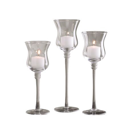 PRICES MAY VARY. LONG STEMMED TEALIGHT CANDLEHOLDERS Pack of 3 elegant candle holders; add sophisticated ambiance to home décor, weddings, dinner parties, and events 3 DIFFERENT SIZES One each of 8-inch, 9.125-inch, and 10.25-inch height; great for using in groupings or individually BEAUTIFULLY CRAFTED Made from premium crystal clear glass with a modern design that suits any décor; create your own look by adding seasonal ornaments, flowers, or greenery CREATE A DRAMATIC DISPLAY Impress your dinn Elegant Candle Holders, Elegant Candle, Glass Pedestal, Candle Holder Set, Tealight, Tea Light Holder, Home Décor, Crystal Clear, Candle Holder