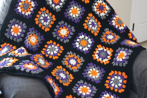 "Ready to Ship with Free Shipping! Matching Pet Blanket Sold Separately Link:   https://www.etsy.com/listing/1282102407/granny-square-halloween-cat-dog-pet?click_key=401cbb36d85a42f883488d91a0f5f921d540e1eb%3A1282102407&click_sum=11ff97c5&ref=shop_home_active_1&frs=1&sts=1 Handmade Halloween afghan with 42 granny squares measuring approximately 39\" x 46\".  Each square is about 6\" x 6\" and is made in Halloween colors of orange, gray, purple and off white.  Squares are hand sewn together so th Knitted Halloween Blanket, Crochet Halloween Door Wreath, Crochet Blanket Halloween, Granny Squares Beginner, Jack O Lantern Granny Square, Halloween Granny Square Blanket, Basic Granny Square Blanket, Halloween Crochet Patterns Free Blanket, Spooky Crochet Blanket