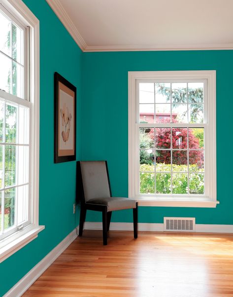 This delicious tropical deep-toned aqua is a lovely color for a dining room or as an overall tropical exterior tone.  Makes a stunning color in a powder room or as an accent wall in a sitting room or bedroom.  Pair with white trim and use magenta, coral and gold accents. View this Glidden paint color, and picture it in your home at https://www.glidden.com/colors/blue-teal/romantic-isle Room Color Combination, Wall Color Combination, Living Room Wall Color, Room Wall Colors, House Paint Interior, Bedroom Wall Paint, Bedroom Wall Colors, Room Paint Colors, Simple Bedroom