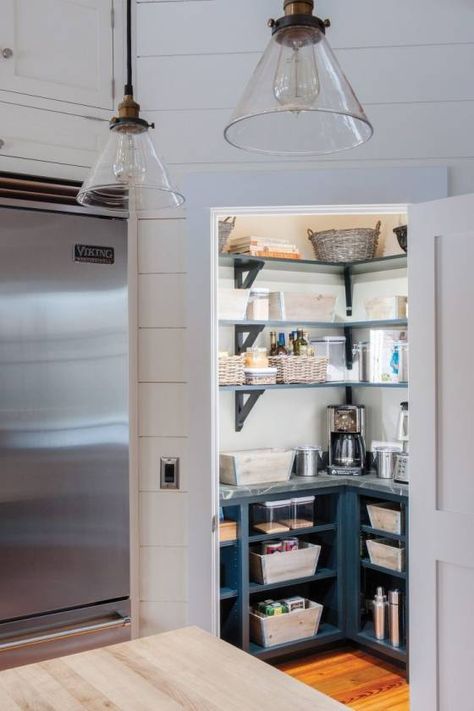 In this photo provided by Crown Point Cabinetry, ample counter space and open shelving with decorative brackets create a functional corner pantry with a place for everything. (Crown Point Cabinetry via AP) Crown Point Cabinetry, Farmhouse Stairs, Stairs Decor, Kitchen Appliance Storage, Larder Cupboard, Declutter Kitchen, Custom Pantry, Corner Pantry, Pantry Remodel