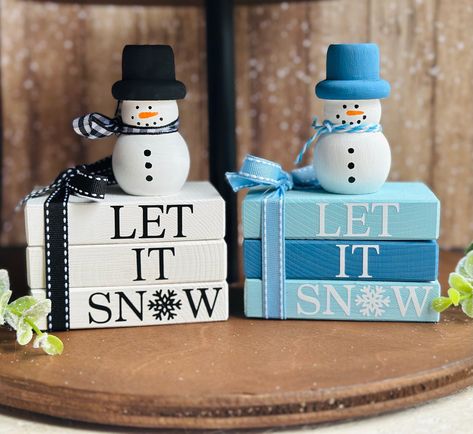 This cute mini wood snowman and matching mini book stacks are the perfect touch for your winter tiered tray decor, Snowman decor or Christmas tiered tray decor.  -Snowmen: 3 inches tall x 1.5 inches wide. -Mini wood book stacks measure: 3.5" x 2.25" *Slight variations will occur between each snowman and book stack. We offer over 900 other holiday and seasonal designs in our shop. https://www.etsy.com/shop/SweetBeanFarmhouse PLEASE READ DESCRIPTION, PROCESSING TIMES & ESTIMATED SHIPPING DATES IN Mini Wooden Ladder Decor, Christmas Book Stacks Diy, Christmas Tiered Tray Decor Diy, Let It Snow Book, Snowman Tiered Tray, Snowmen Diy, Farmhouse Christmas Decor Ideas Diy, Winter Tiered Tray Decor, Wood Books