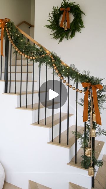 Kasey Dixon on Instagram: "HOLIDAY \ Christmas staircase styling!✨ Layering all the garland, gold beads and mini lights with velvet bows and bells!🔔🔔 SO many great finds from Target and Amazon in this setup! Happy decorating! Here are 3 easy ways to SHOP👇🏻 1. Comment “shop” to get links sent directly to your DMs 2. Click the link in my bio @sbkliving and select “shop my reels” 3. Head over to my @shop.ltk shop and follow me “sbkliving” #holidaydecorating #christmasdecor #christmasdecorating #christmasstyling #christmasgarland #amazonhome #christmasdecoration #targethome" Stair Christmas Garland Decoration, Outdoor Stair Railing Christmas Decor, How To Tie Garland To Stairs, Hanging Garland On Stairs Railings, Stairs Garland Christmas, Railing Garland Christmas, Christmas Garland Stairs, Banister Christmas Decor, Christmas Banister Decorations