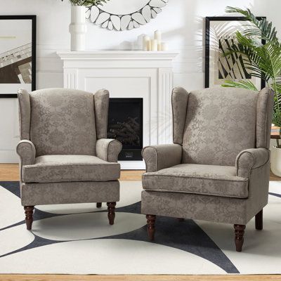 Arriving as a 2-piece set, this armchair shows off eye-catching upholstery in a colour palette of your choosing. It has a wooden frame that rests on walnut-toned turned, tapered front legs. The rest of the piece is wrapped in a polyester-blend fabric with a foam-filled interior and sinuous springs that provide plenty of support as you relax. Rolled, recessed arms and a fixed back round out the design. A minimum door width of 34" is needed for home entry. Lark Manor Body Fabric: Brocade Polyester Printed Accent Chairs, High Back Accent Chairs, Traditional Accent Chair, Wingback Dining Chair, Traditional Armchairs, Comfortable Space, Linen Armchair, Accent Arm Chairs, Ottoman In Living Room