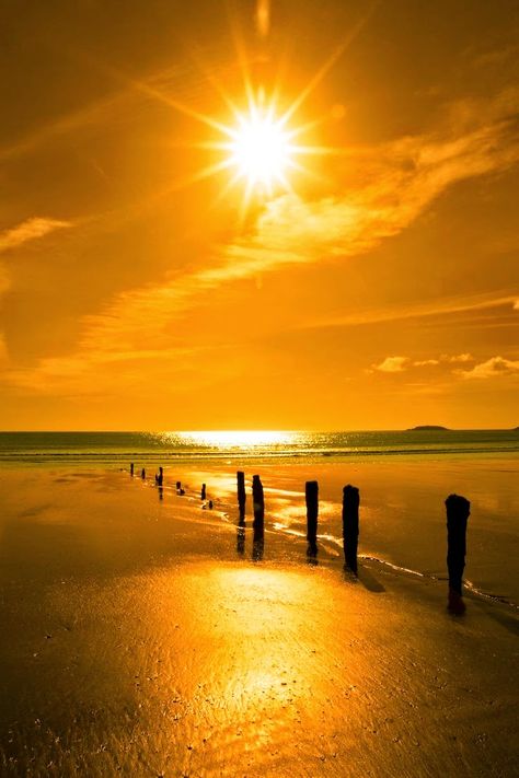 Golden sunshine over the beach breakers and blue Atlantic sea in Youghal County, Cork Ireland on a summers day. Matka Natura, Amazing Sunsets, Beautiful Sunrise, Beautiful Sky, Beautiful Sunset, The Sand, Belle Photo, Sunrise Sunset, Beautiful World