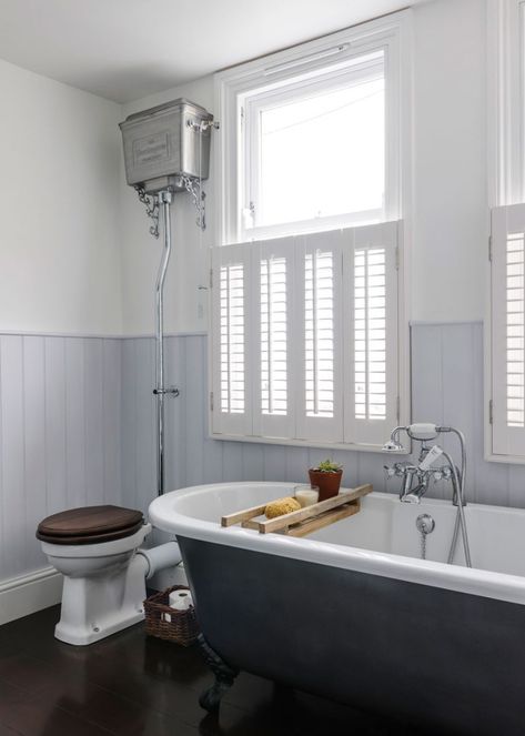 Window shutters – everything you need to know about this timeless window covering | Ideal Home Modern Bathroom Victorian House, Window Dressing Bathroom, Baths Under Windows, Cottage Window Dressing, Bath Under Window, Rolltop Bath, Bathtub Window, Bathroom Window Dressing, Window Dressing Ideas