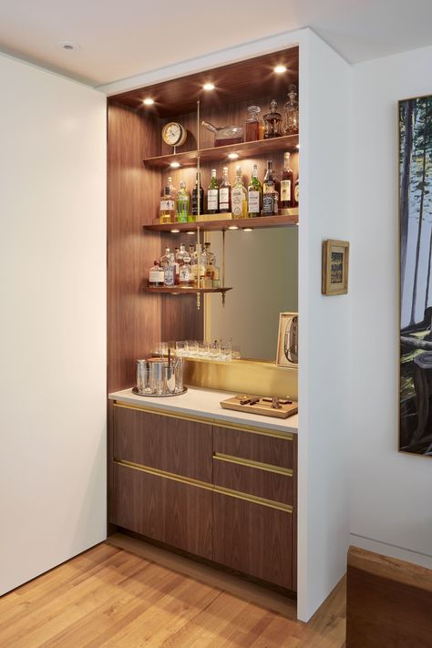 Behind a concealed closet door, this home bar mimics the design of professional setups. Concealed Closet, Built In Bar Cabinet, Small Home Bar Ideas, Modern Home Bar Designs, Home Bar Counter, Small Bars For Home, Closet Bar, Home Bar Cabinet, Bar Mini