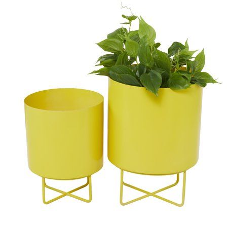 "Give your plants refreshing display containers with these planter pots set in your home corners, balcony, or indoor garden. This item features a deep pot with slender structure making a friendly planter for any compact space. Add some greenery into your living space for a refreshing look with a comforting element and better air quality in your home. These items come shipped in one carton. Suitable for indoor use only. Made in India. Planters do not have drainage holes. Set of 2 nesting metal pl Round Planters, Yellow Planter, Wood Wagon, Pots Set, Modern Planter, Black Planters, Cosmoliving By Cosmopolitan, Indoor Outdoor Planter, Corner House