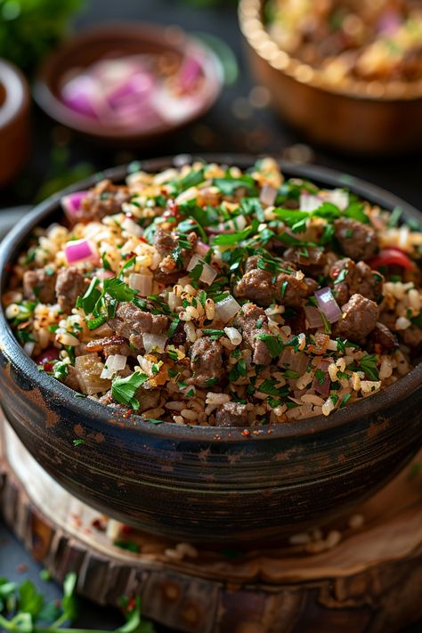 A bowl of seasoned rice with beef chunks, garnished with chopped green onions and red onions. 7 Spice Recipe, Authentic Mujadara Recipe, Maqluba Recipe, Mujadara Recipe, Spanish Tortilla Recipe, Lentils Rice, Meal Rotation, Lebanese Cuisine, Middle Eastern Dishes