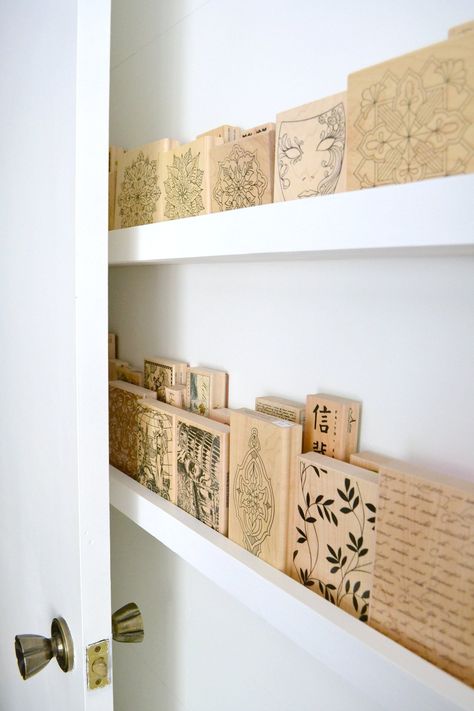 17 back of door storage ideas to get the most out of your space | Style Curator Wood Block Stamp Storage, Diy Ledge, Behind Door Storage, Scrapbook Room Ideas, Scrapbooking Storage, Craft Room Storage Ideas, Scrapbook Rooms, Craft Storage Solutions, Ribbon Storage