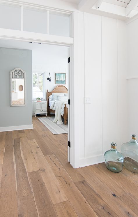 White and Blue lake house master bedroom. Rustic warm woods, white planked walls, and pale blue/gray walls give a serene feeling to this lake home. Blue Gray Walls, Blue Lake House, White Plank Walls, Lake House Master, Planked Walls, Blue Grey Walls, Bedroom Rustic, Gray Walls, Plank Walls