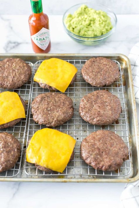 Don’t worry about grilling this winter. This simple, baked hamburgers recipe is perfect for a crowd and the patties are cooked in the oven at 425˚ for juicy, flavorful burgers that are ready for your favorite toppings. #burgers #hamburgers Oven Baked Hamburger Patties Ground Beef, Homemade Hamburgers In Oven, Baking Frozen Hamburgers In Oven, Bake Frozen Hamburger Patties Oven, How Long To Bake Hamburger Patties In Oven, How To Cook Frozen Hamburger Patties, How To Cook Frozen Burgers In Oven, Baked Burger Patties, Baked Frozen Hamburger Patties