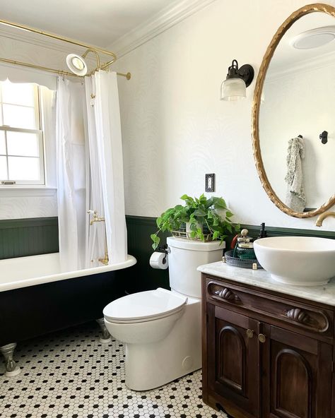 There were so many good things already going on in this bathroom, but it definitely needed a facelift! I *loved* the clawfoot tub and the vanity was so unique. We ended up replacing the diverter, doing some drywall repair, completely repainting everything from the ceiling down, adding a Bluetooth speaker fan, wallpapering, changing out the mirror and adding additional storage. I absolutely love the color palette in this space and all of the character! What do you think of the white wal... Claw Foot Tub Shower Combo, Clawfoot Tub Shower Combo, Clawfoot Tub Bathroom, Clawfoot Tub Shower, Drywall Repair, Tub Shower Combo, Clawfoot Tub, The Ceiling, Drywall