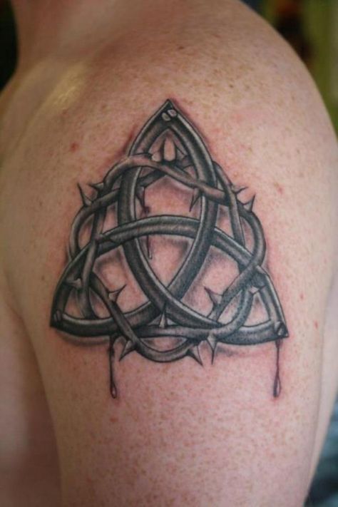 11 Irish Trinity Knot Tattoo Celtic Trinity Knot Tattoo, Trinity Knot Tattoo, Cross Tattoo Meaning, Celtic Tattoos For Men, Shoulder Armor Tattoo, Trinity Tattoo, Holy Trinity Tattoo, Small Wave Tattoo, Celtic Knot Tattoo