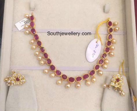 22 carat gold light weight necklace adorned with rubies and south sea pearls. Weight: 18 grams For price inquiries contact on Whatsapp: +91 97 00 009000 or Email: dharmesh25@yahoo.com Related Posts5 Grams Black Beads MangalsutraLight Weight Gold NecklaceLight Weight Layered Beads NecklaceLight Weight Guttapusalu Necklace SetLight Weight Mango NecklaceTwo Step Pacchi Haram Light Weight Gold Jewellery, Guttapusalu Necklace, Ruby Necklace Designs, Simple Necklace Designs, Temple Jewellery Earrings, Necklace Photo, Antique Gold Jewelry Indian, Pearl Jewelry Design, Gold Jewelry Simple Necklace