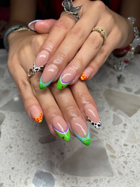 Toy Story Almond Nails, Universal Inspired Nails, Tower Of Terror Nails, Buzz Lightyear Nail Art, Woody Toy Story Nails, Toy Story Alien Nails, Universal Studios Nails Design, Bobs Burgers Nails, Buzz Lightyear Nails