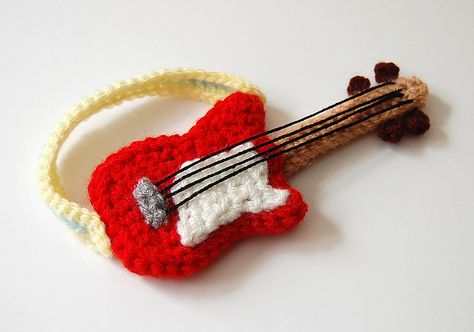 Amigurumi Guitar pattern for sale on Etsy https://www.etsy.com/listing/75185729/crochet-pattern-guitar?ref=sr_gallery_7&ga_search_query=Crochet+guitar+pattern&ga_order=most_relevant&ga_view_type=gallery&ga_ship_to=ZZ&ga_search_type=all Crochet Music, Guitar Patterns, Crochet Vintage, Haken Baby, Knitting Bags, Paintbox Yarn, Crochet Applique, Yarn Needle, Crochet Dolls