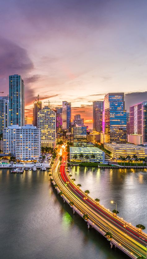 The picture represents a dusk scenery of Miami downtown, its high rises and local Marina. Miami Skyline Wallpaper, Miami Wallpaper Iphone, Miami Background, Miami Culture, Miami Landscape, Aesthetic Cities, Miami Bar, Miami Wallpaper, Miami Downtown