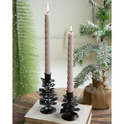 This set of two antique brown pine cone taper holders is a classy addition to any table. Four per box means this set is perfect for the groom's table or other reception-style events. Made in India. The Holiday Aisle® | The Holiday Aisle® 6" Metal Tabletop Candlestick Holder Brown 6.0 x 3.0 x 3.0 in | C110519605 | Wayfair Canada Metal Pinecone, Groom's Table, Grooms Table, Christmas Angel Figurine, Pre Lit Christmas Tree, Pine Garland, Taper Holders, Small Figurines, Hanging Wreath