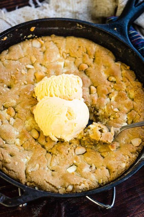 A White Chocolate Macadamia Nut Pizookie in a cast iron skillet with vanilla ice cream on top Pizookie Recipe, White Chocolate Macadamia Nut Cookies, White Chocolate Macadamia Nut, Feed The Hungry, Bar Desserts, Macadamia Cookies, Skillet Chocolate Chip Cookie, Warm Desserts, Macadamia Nut Cookies