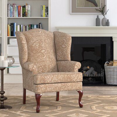 This armchair brings traditional style to your living room, library, or den. It’s made in the USA from solid, kiln-dried maple and poplar wood. The upholstery is plush, foam-filled chenille in a neutral, monochromatic paisley print. This chair has a drop-in coil suspension system and welting on all its seams, with double welting above the front legs. Its cushion is removable and reversible. With its handsome wingback silhouette, rolled arms, and cabriole front legs, this accent chair is a classi Wingback Accent Chair, Chair Dimensions, Chair Types, Beautiful Chair, Chair Style, Design Fabric, Garage Sale, Chenille Fabric, Paisley Design