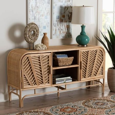 Foster an atmosphere of serenity in your space with the stunning Carabella storage cabinet. Made in Indonesia, this bohemian piece is handcrafted from natural rattan by skilled artisans. Two open shelves serve as a fantastic display area, while the doors open to reveal four additional shelves to organize and declutter busy areas of your home. The Carabella will arrive fully assembled and exhibits beautifully woven exteriors embellished with rattan pole for a captivating display in any layout. Serving as a fantastic solution to your needs in rustic style, the Carabella storage cabinet is sure to refresh any arrangement. Disclaimer: Rattan is a product of nature and may have variations in areas such as, but not limited to, color, pattern, grain and texture. The hair-like strands of rattan/ra Organize And Declutter, Display Area, Sideboard Storage Cabinet, Cabinet Bed, Sideboard Storage, Door Storage, Open Shelves, Tv Cabinet, Cabinet Furniture