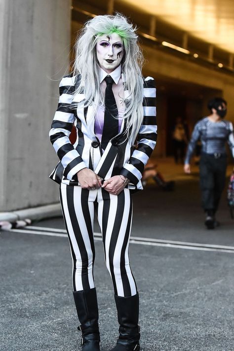 Nothing says "Happy Halloween" like becoming Beetlejuice for a night. You'll knock 'em "dead, dead, deadski"! Click through to see more Halloween costumes inspired by the ‘80s! #80shalloweencostume #80shalloweencostumesforcouples #1980shalloweencostumes #costumesfromthe80s Diy Alien Costume, 1980s Halloween Costume, All Black Halloween Costume, Beetlejuice Halloween Costume, Black Dress Halloween Costume, 80s Halloween Costumes, 1980s Outfits, Beetlejuice Costume, Black Halloween Costumes