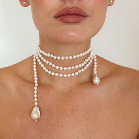 White fresh water pearls sit on a 170cm cotton thread piece, finished with a baroque pearl at each end. This pearl necklace is fabulously unique and versatile. See the images for the many ways to wear this necklace. Wrap it, tie it, loop it, wear it! A timeless and fabulous pearl necklace. Avoid perfume and hairspray. Store in a safe place to avoid scratching. Dangly Pearl Necklace, Wedding Statement Necklace, Tie Necklace Diy, European Jewelry Trends, Cool Pearl Necklace, Funky Necklaces Jewelry, Bohemian Pearl Necklace, Luxury Pearl Jewelry, She’ll Necklace