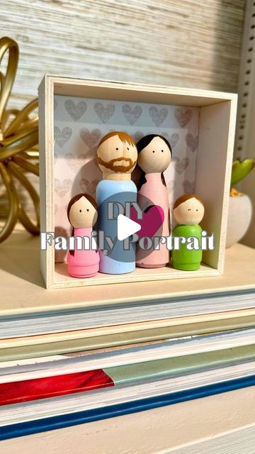 Bre | DIY Home & Crafts on Instagram: "Pro tip: keep the peg dolls paint job super simple to avoid them looking clownish. (Not that I learned from experience or anything. 😂)  Got a giant family? You can use a larger shadow box or a dimensional wood sign!  I think this 3D family portrait would be a sweet Mother’s Day gift, and you still have time to make one!  Or save this Reel and make it for another reason or to display in your own home.   ❤️ Want a shoppable supply list? Comment LIST and I will DM it to you!  #craftersgonnacraft #mothersdaygiftideas #sentimentalgifts #makeitwithmichaels #homedecordiy #diyhomedecor #familycrafts #woodcrafts #pegdolls" Peg Doll Characters, Peg Dolls Diy, Peg Dolls Ideas, Wednesday Peg Dolls, Peg Doll Painting Tips, Large Shadow Box, Peg Doll Family Portrait, Peg Doll Family, Emotion Peg Dolls