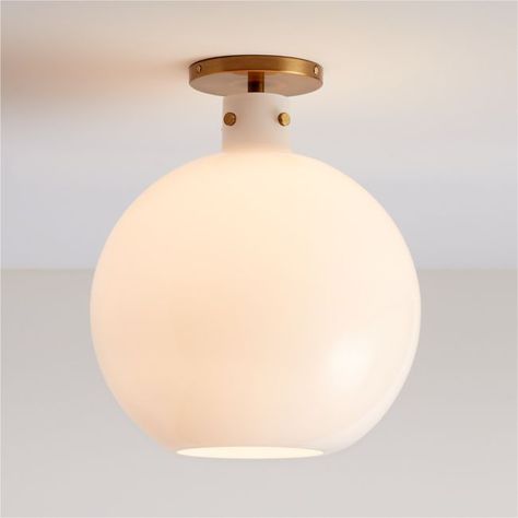 Detailed with oversized knurled screws, our Dakota flush mount light balances crisp modernity with subtle industrial beauty. The result is a timeless light fixture with a straightforward presence overhead. Hand-blown by talented artisans, the large white milk glass shade shapes a bulb-like globe that contrasts softly with the gleaming brass base and industrial-inspired screws. Our exclusive mix-and-match Dakota collection offers versatile lighting options with a custom feel.   • Hand-blown milk Pendant Light Over Kitchen Sink, Timeless Light Fixtures, Hanging Lights Living Room, Brass Flush Mount Light, Brass Flush Mount, Light Balance, Round Pendant Light, Flush Mount Light, Dome Lighting