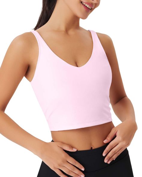 PRICES MAY VARY. ♥MATERIAL of Womens Sports Bras: 80% Nylon,20% Spandex. The Workout Tops Sport Bra is soft, 4-way high-stretch fabric, of moderate thickness and breathable, skin-friendly, lightweight, quick dry, double-sided, Moisture-wicking and on-trend athletic. Workout tank top keeps cool by air circulate, maintains shape and color after wash and activewear. There’s enough underarm room of the elastic crop top for exercise. This long line supportive bra top has a skin-like fit, feels like n Shirts With Built In Bras, Pink Sports Top, Cute Workout Fits, Cute Workout Sets, Gym Tops Women, Yoga Workout Clothes, Gym Crop Top, Athletic Tops, Barbie Halloween