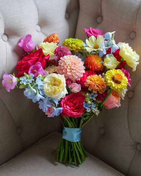 Vibrant petals for Megan’s beautiful bridal bouquet, bursting with the brightest, happiest colours you can imagine! 🌸💛💙💖 From hot pinks to electric blues, this bridal bouquet is all about vibrant vibes using a mix of bold and beautiful blooms for a truly colourful wedding at the iconic Fulham Palace, London. We got to embrace one of our favourite seasonal flowers, dahlias, and specialty blooms from @backyard__flowers with zinnia and cosmos! Who else is loving these colors as much as we a... Bright Peony Bouquet, Hot Pink And Blue Bouquet, Zinnia Bridal Bouquet, Fulham Palace, Bright Wedding Bouquet, Flowers Dahlias, Orchid Bouquet Wedding, Luxury Florists, Palace London