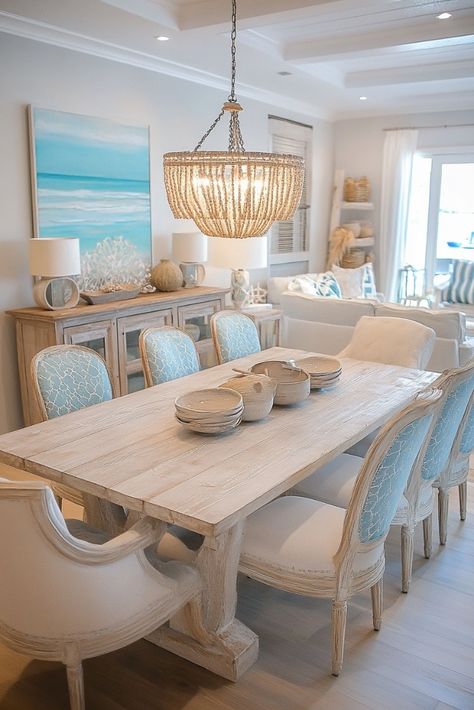 "🌊🍽️ Transform your dining space with Coastal Dining Room Decor! Think light, breezy vibes with nautical accents, driftwood, and soft blues. Perfect for a relaxing, beach-inspired meal at home. 🐚🌴 #CoastalDecor #DiningRoomDesign #BeachStyle" Beach House Chandelier Dining Rooms, Blue Coastal Dining Room, Beachy Dining Table, Beachy Dining Room Ideas, Luxury Bedroom Master Modern White, Beach Glam Decor, Costal Kitchens, Coastal Breakfast Nook, Glam Dining Room Ideas