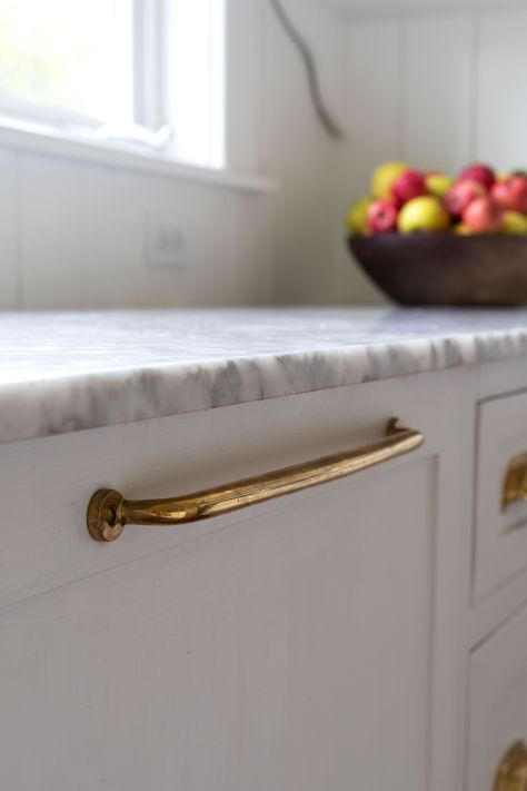 one year of age on our unlacquered brass hardware // the farmhouse kitchen on www.thegritandpolish.com Different Hardware In Kitchen, Brass Cabinet Handles Rustic, Aged Unlacquered Brass Hardware, Unlacquered Brass Pull, Classic Brass Kitchen Hardware, Brass Hardware White Kitchen, Rejuvenation Massey Hardware, White Kitchen Cabinets Transitional, Old Fashioned Cabinet Hardware