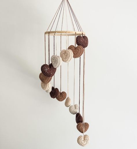 Our ‘Little Love’ neutral mobile is the dreamiest addition to your gender neutral/boho nursery 😍🤎 Did you know we also make custom mobiles in any colour of your choosing? Check out the colour range online today! . . . . . #maggieandmay #mobile #nurserydecor #babymobile #bohonursery #beigenursery #beigebaby #genderneutral #genderneutralnursery #neutralnursery #crochet #customcrochet Crochet Mobile Baby, Crocheted Hearts, Beige Nursery, Crochet Nursery Decor, Boho Mobile, Crochet Nursery, Neutral Boho, Custom Crochet, Nursery Mobile