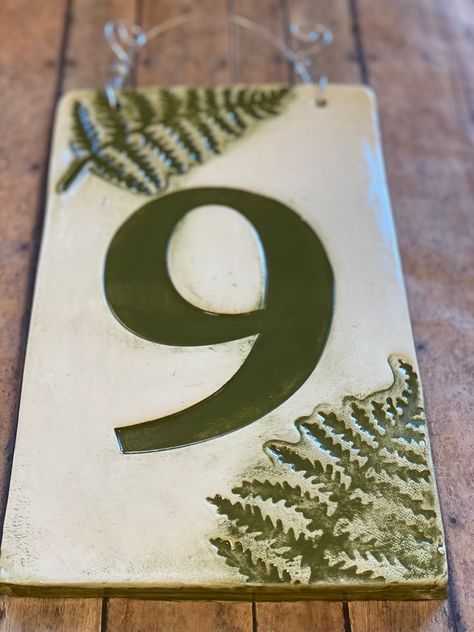 "**Please indicate your house number as you wish for it to appear in the 'comments/notes' section when prompted at check out** Single Digits Only  DESIGN SPECIFICS  Beautiful handmade ceramic house number tile plaque, glazed in sarge army green with impressed ferns on opposite corners. This digit is big! We create our own number stamps and this large digit design is one of our favorites. If you have a single number address this may be the perfect house number to adorn  your door! Easily viewed f Tile House Numbers, Number Tiles, Ceramic House Numbers, The Perfect House, Beginner Pottery, Pottery Houses, House Number Plaque, Clay Houses, Door Numbers