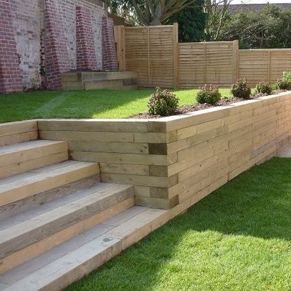 Garden Sleepers - What's the Difference? | Suregreen Ltd Small Garden Design Low Maintenance, Railway Sleepers Garden, Sleepers In Garden, Shelter Ideas, Garden Retaining Wall, Railway Sleepers, Sloped Backyard, Landscaping Retaining Walls, Garden Stairs