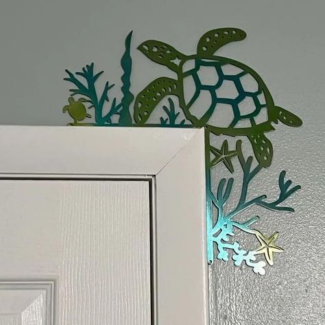 PRICES MAY VARY. 🐢Versatile Decor: Whether you have a beach-themed home or just want to infuse a bit of coastal charm into your decor, our door corner decor is the perfect choice. Sea Turtle Door Frame Decoration fits seamlessly into various design styles, making it a versatile addition to any door. 🐢Sea Turtle Door Frame Decoration: Elevate the charm of your home's entry with our exquisite Metal Sea Turtle Door Corner Decor. This stunning piece is more than just a door topper; Sea Turtle Door Turtle Bathroom Decor, Door Frame Decoration, Aquatic Decor, Metal Turtle, Sea Turtle Decor, Lagom Design, Turtle Theme, Sea Turtle Wall Art, Coastal Style Decorating