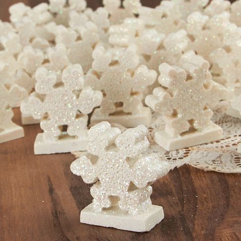 Winter Wonderland Snowflake Table Favor Set. Full of sweet, dazzling holiday charm, this standing Winter Wonderland Snowflake Table Favor Set guarantees to give your winter and Christmas surroundings a charming hint of winter and Yuletide spirit.    These small accents are perfect for the home or office as an excellent addition to your desk, mantel, end table, or coffee table. Also consider bringing enchantment to your dioramas, apothecary and Mason Jar displays, and other miniature scenes.    These items have been deeply discounted due to some excess glue at the base. With a bit of extra work the glue may be chipped away or hidden.    Made of resin. Designed for indoor use. Winter Wonderland Table Decorations, Winter Wonderland Table Setting, Snowflake Centerpieces, Snowflake Table, Winter Table Decor, Jar Display, Winter Holiday Crafts, Table Favors, Miniature Scenes