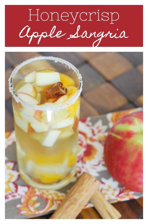 Honeycrisp Apple Sangria - the perfect fall drink! White wine sangria with honeycrisp apples, oranges, ginger, cinnamon, and cloves. Plus a cinnamon sugar rim! Apple Pie Cocktail, Cinnamon Sugar Rim, Honeycrisp Apple, Apple Sangria, White Wine Sangria, Holiday Snack, Wine Sangria, Pumpkin Cream Cheese Muffins, Fall Drink