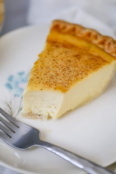 Creamy Custard Pie - This Old-Fashioned, beloved Custard Pie is so creamy, light and silky smooth.  You won't believe how quick and easy this custard is to whip it up, with just using 5 simple ingredients like cream, eggs, sugar, vanilla and nutmeg.