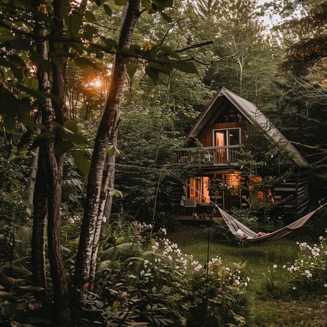 Forest Cabin Serenity: Secluded cabin nestled in the heart of a lush forest, glowing warmly as dusk settles. #NatureLovers #Getaway #PeacefulRetreat #Woodland #OutdoorLife #ScenicEscape #RelaxationStation #DreamDestination ⬇️ Download and 📝 Prompt 👉 https://stockcake.com/i/forest-cabin-serenity_795235_368771 House In Middle Of Forest, Forest Landscaping Ideas Woods, Farm In Forest, Shack In Woods, House In The Forest Nature, Cottage In The Woods Aesthetic, Diy Forest Decor, Forest Cottage Aesthetic, Forest Hammock