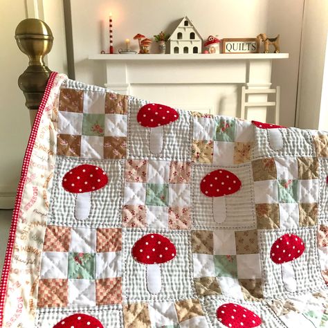 This little quilt is a celebration of the whimsical autumn favourite...the red spotted toadstool. It is made with patchwork, applique and hand quilting to create lots of texture and give a rustic feel. It is a throw size quilt but can easily be made into a larger quilt by increasing the number of blocks. Perfect for cosy fall days! Size: 38in x 32in (96.52 x 81.28cm) approx Kids Quilted Blanket, Patchwork Quilt Designs, Throw Blanket Quilt, Quilt Patterns Flower, Old Fashion Quilt Patterns, Small Quilt Projects For Beginners, Mushroom Quilt Pattern, Kids Quilts Ideas, Fall Quilt Blocks