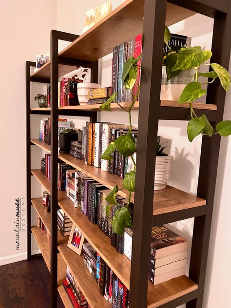 Industrial style bookshelf with black painted ladder uprights and plywood shelves. Side By Side Bookshelves, Diy Open Shelf Bookcase, Bookshelf Wood Design, Backless Bookshelf, Diy Wood Bookshelf, Bookshelf Hallway, Free Standing Bookshelves, Bookshelf Ideas Living Room, Long Bookshelf