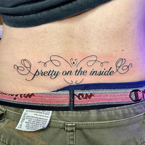 Chappell Roan Tramp Stamp, Cursive Tramp Stamp, Tramp Stamp Tattoos Ideas, Name Tramp Stamp Tattoos, Tramp Stamp Name Tattoos, Angel Tramp Stamp, Tramp Stamp Aesthetic, Tramp Stamp Tattoos Black Women, Tramp Stamp Tattoos Words