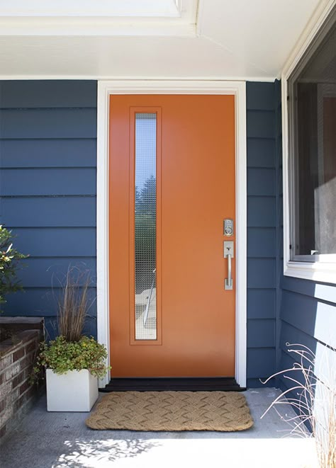 Navy Blue House Exterior Orange Door, Mid Century Front Door Ideas, Mid Mod Front Doors, Color Pop Front Door, Modern Painted Front Door, Mid Century Orange Door, Mcm Exterior Door, Rustic Orange Front Door, Mid Century Exterior Door