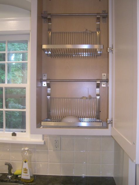 I had the bottom of a standard wall cabinet cut out and installed 2 ikea drying racks inside. I then asked the countertop installers to grind grooves and a slight slant into the granite allowing water dripping from the drying cabinet to run directly into the sink. Kitchen Rack Design, Kitchen Sink Drying Rack, Drying Cabinet, Tiny Kitchens, Sink Drying Rack, Drying Racks, Dish Drainers, Dish Rack, Dish Rack Drying